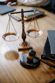 pexels photo 5669619 5669619 A striking image featuring a brass justice scale and gavel on a wooden desk, symbolizing law and justice.